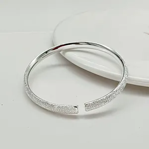 Adjustable S999 sterling silver open bangle with matte frosted finish and starry texture