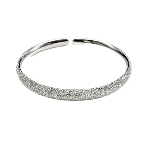 Adjustable sterling silver open bangle with a frosted starry finish and polished interior