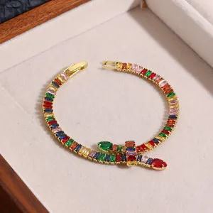 Close-up of rainbow marquise cubic zirconia and gold-plated metal links on the bracelet