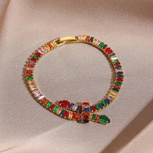 Adjustable gold bracelet featuring colorful marquise-cut zircons on elegant champagne satin