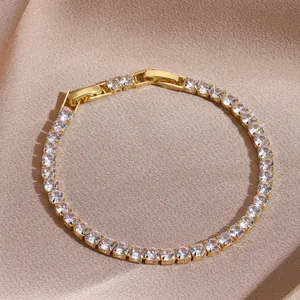 Detail of adjustable gold tennis bracelet with shimmering marquise zircon stones