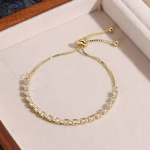 Detail view of adjustable gold-finish bracelet with pear-cut cubic zirconia and sliding clasp