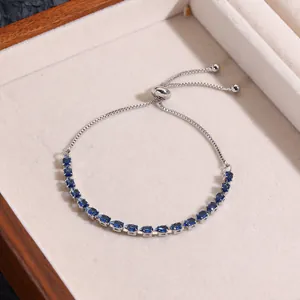 Detail of adjustable silver bracelet with marquise-cut blue cubic zirconia and sliding clasp