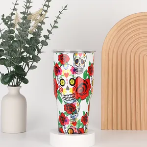 Detailed view of 30oz tumbler with colorful sugar skull and red rose floral design