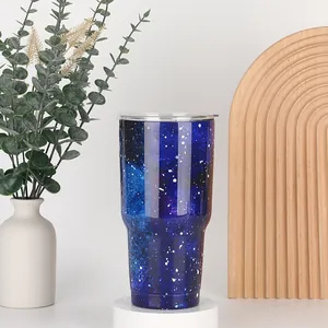 Detail of 30oz stainless steel tumbler with dark blue and purple galaxy starry pattern