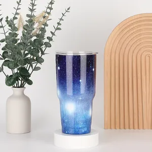 Detail of 30oz stainless steel tumbler with starry night galaxy gradient print and lid