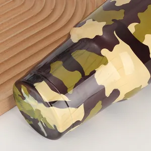 Macro view of 30oz insulated tumbler featuring classic jungle camouflage coating finish