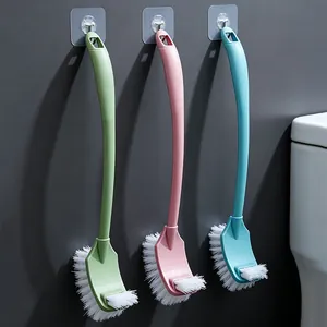 Three colorful long-handled toilet brushes hanging with double-sided cleaning heads