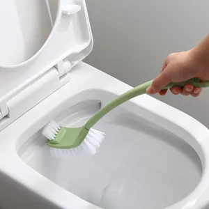 Long-handled double-sided toilet brush for efficient bathroom cleaning with green handle