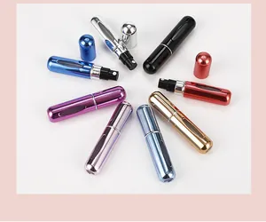 Detail view of colorful 5ml portable perfume atomizers in a circular spray arrangement