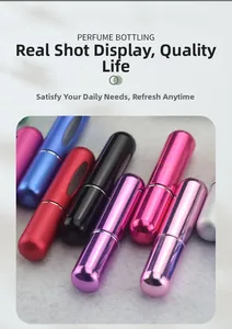 Detail of colorful 5ml refillable perfume spray bottles with transparent liquid window