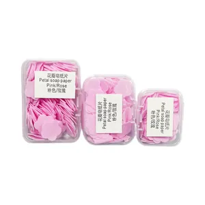 Portable pink flower soap paper sheets in three travel-sized boxes with rose scent