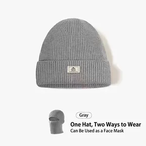 Grey ribbed knit balaclava showing transition from beanie to full face mask