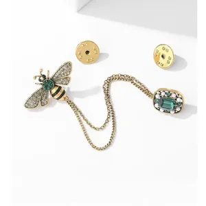 Vintage bee chain brooch with emerald green gemstones and pearls in antique gold finish