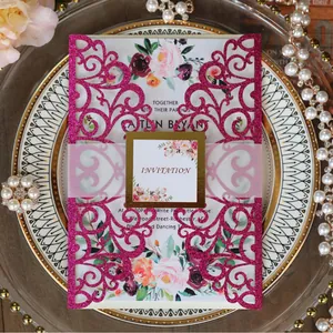 Elegant laser cut fuchsia glitter wedding invitation set with floral card and gold foil belly band