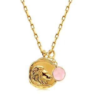 Detailed view of 18k gold plated lion pendant with a round pink natural birthstone charm