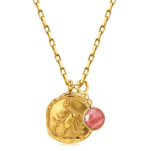 Detail of 18k gold Scorpio pendant with textured finish and pink gemstone necklace