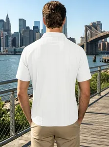 Rear view of a men's white textured polo shirt with urban skyline background