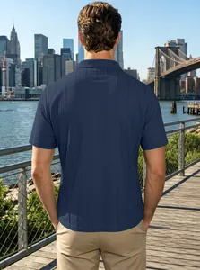 Rear view of dark blue short sleeve Polo shirt with textured vertical stripe fabric