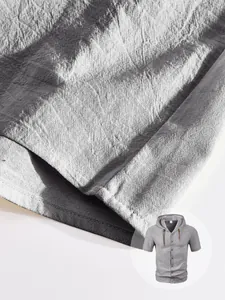 Detail of light gray men's linen hoodie shirt with brown leather drawstring and buttons