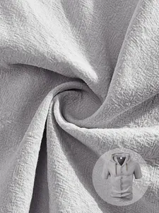 Close-up detail of breathable linen texture on a men's light grey hooded casual shirt