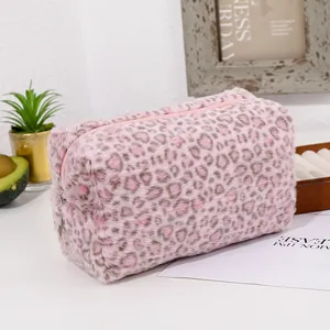 Detailed texture of pink leopard faux fur cosmetic bag with high-density plush and zipper