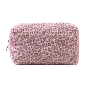 Close-up of the soft plush pink leopard print fabric and metallic zipper on makeup bag