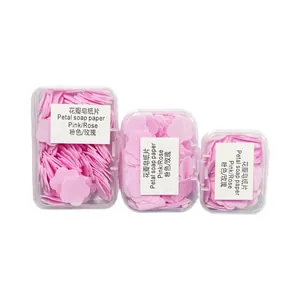 Portable pink petal-shaped soap paper sheets in three transparent travel storage cases
