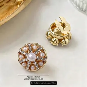 Luxurious gold round cufflinks with central pearl and micro crystals on marble, size 25mm