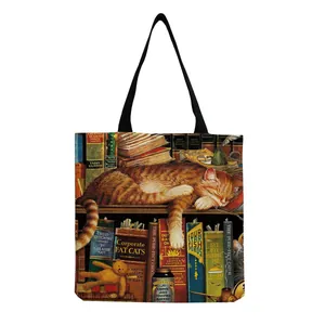 Detailed view of canvas tote bag featuring an artistic orange cat and bookshelf print