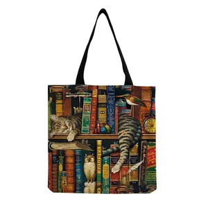 Detailed close-up of a tote bag featuring a vintage bookshelf and a sleeping cat print