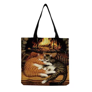 Detailed close-up of a durable canvas tote bag featuring a cute cat art print on a white base