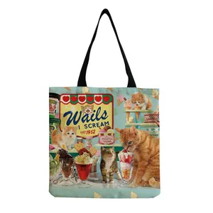 Detail of vintage cat and ice cream print on light blue canvas reusable tote bag