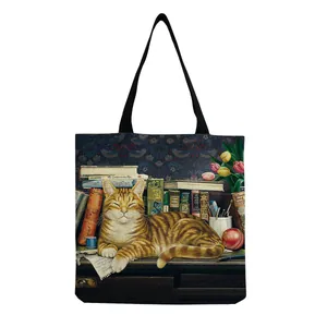 Close-up of cat print canvas tote bag showing vintage book spines and orange tabby pattern
