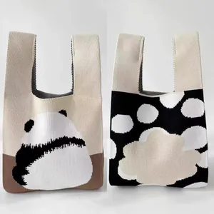 Detail of premium thick knitted panda tote bag and stylish polka dot pattern handbags