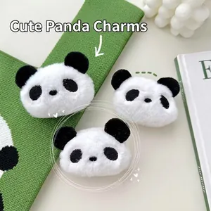 Close-up of plush panda head charm with soft faux fur texture and cute black and white details