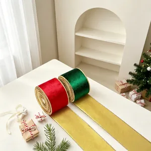Detail of red and green velvet Christmas ribbons with sparkling gold metallic edges