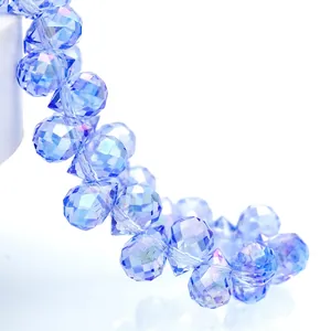 Macro view of blue faceted teardrop crystal beads with high-refraction sparkling finish