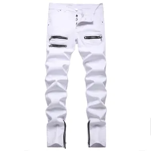 Detail of white slim fit biker jeans featuring metallic side zippers and button fly