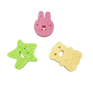Soft wood pulp baby bath sponges in cute pink bunny, green star, and yellow bear shapes
