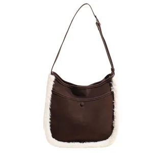 Brown suede bucket bag with white faux fur trim and adjustable strap for women