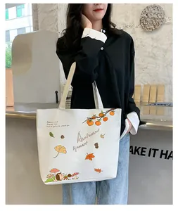 Detail of canvas tote bag with autumn illustration of persimmons and hedgehog