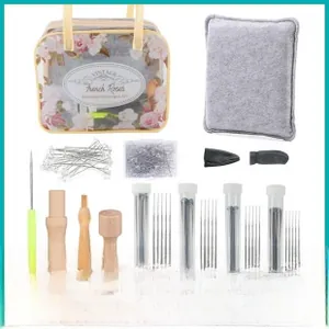 Detail view of wool felting kit with needles, wooden tools, felt pad and floral storage bag