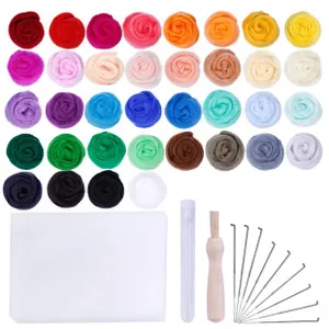 Flat lay of 36-color wool felting kit with foam pad and needle tools on white backdrop