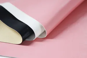 Close-up of litchi grain PU leather fabric for manicure stool in pink, white and black