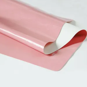 Detail of pink faux leather footrest upholstery with soft lychee texture and white backing