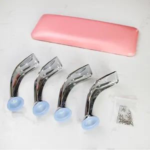 Pink PU leather nail armrest components with silver metal legs and assembly tools