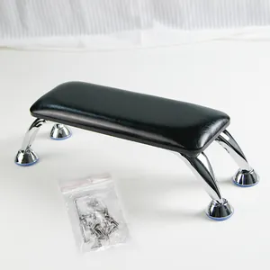 Detail of professional nail hand rest with black leather cushion and silver chrome metal legs