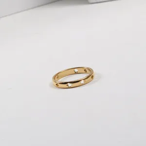 Detailed macro shot of 18k gold plated stainless steel ring with hollow star patterns