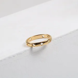 Polished 18k gold plated stainless steel ring with hollow star patterns on white stone
